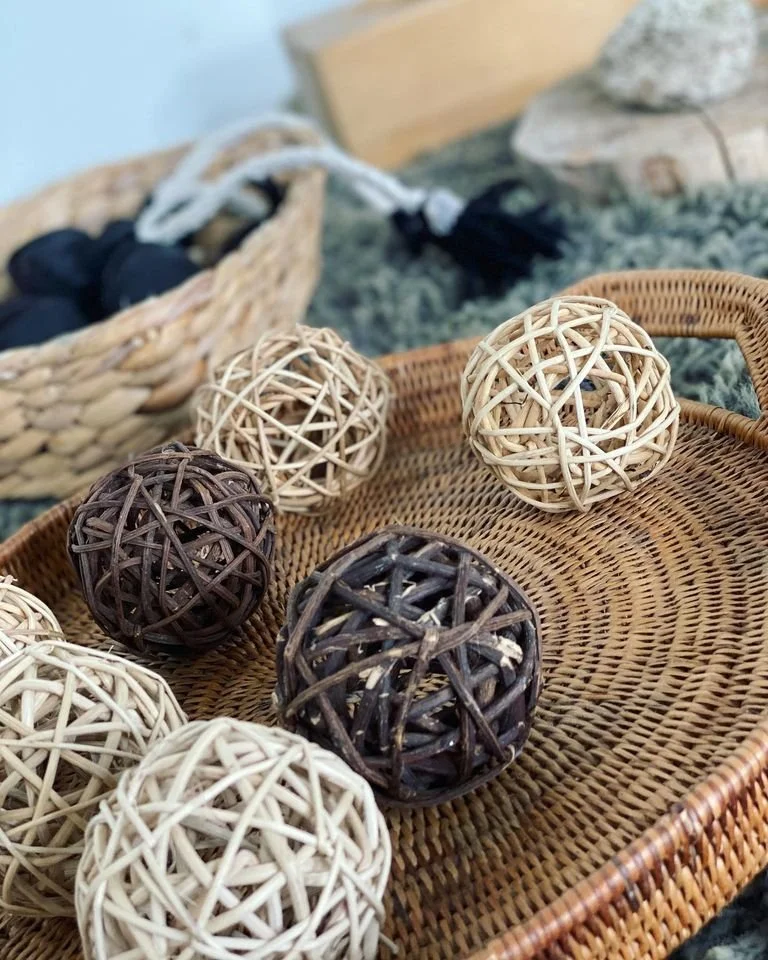 Natural wooden balls arranged as an open-ended play invitation.